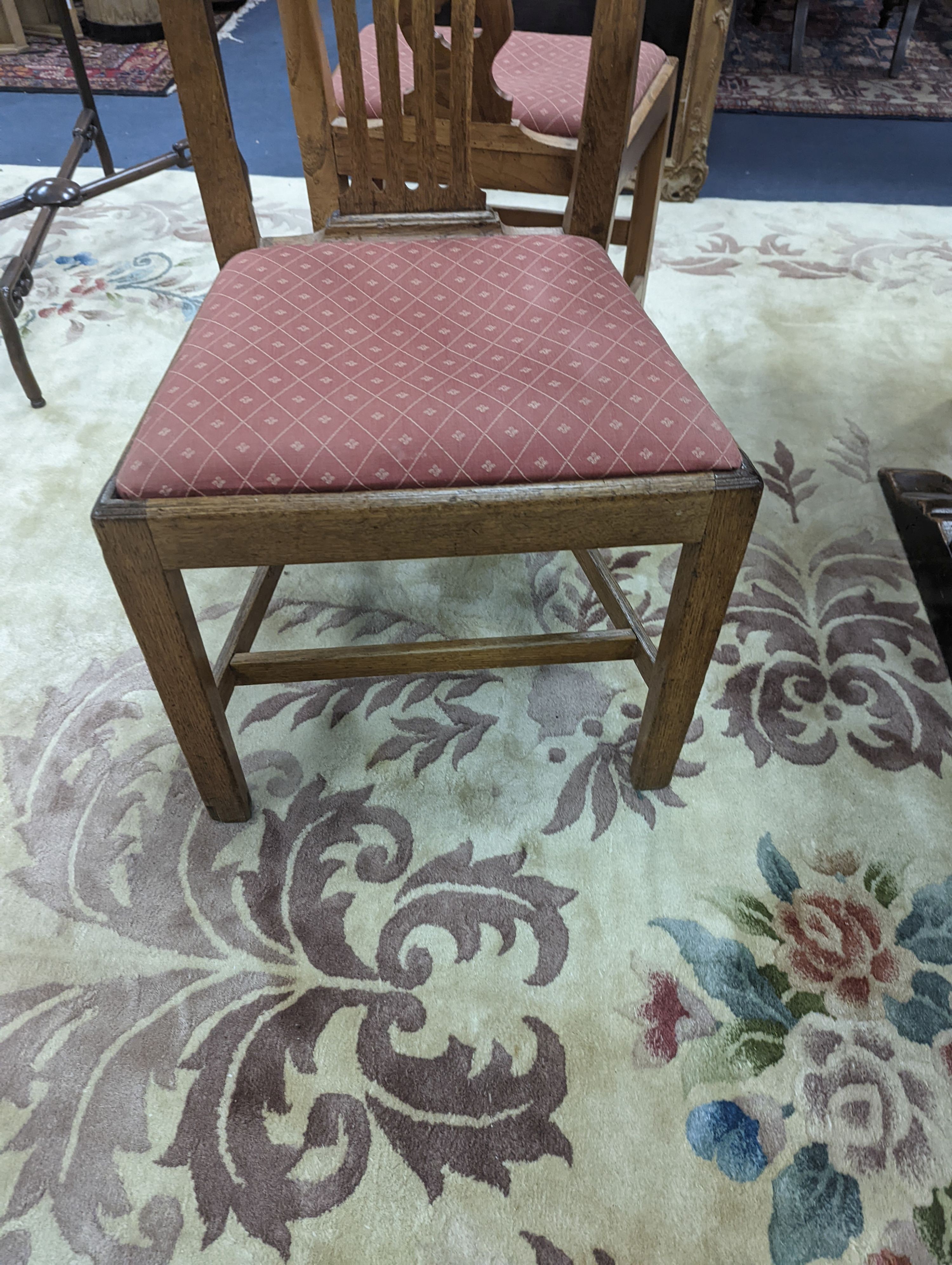 A harlequin set of eight George III provincial oak and elm dining chairs. H-96cm.